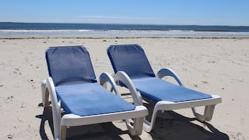 On the beach, beach cabanas, sun loungers