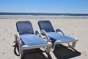 On the beach, beach cabanas, sun loungers
