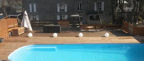 Outdoor pool, a heated pool, pool loungers