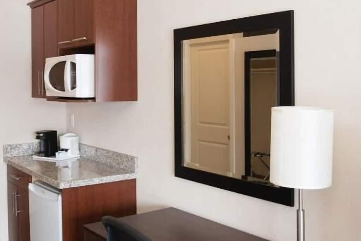 deluxe room, 1 king bed, kitchen | desk, laptop workspace, blackout curtains, rollaway beds