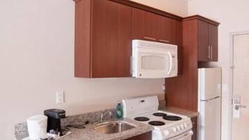 Microwave, stovetop, coffee/tea maker, cookware/dishes/utensils