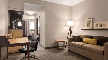 Desk, laptop workspace, blackout drapes, iron/ironing board