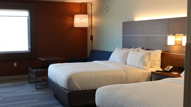 A hotel room with two beds, a desk, and a lamp. - Holiday Inn Express & Suites Omaha - Millard Area by IHG (Omaha)