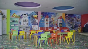 A children's playroom with colorful furniture and educational murals on the walls. - Club Aqua Plaza (Alanya)