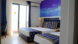 A hotel room with two beds, a balcony, and a painting of a beach scene. - Club Aqua Plaza (Alanya)