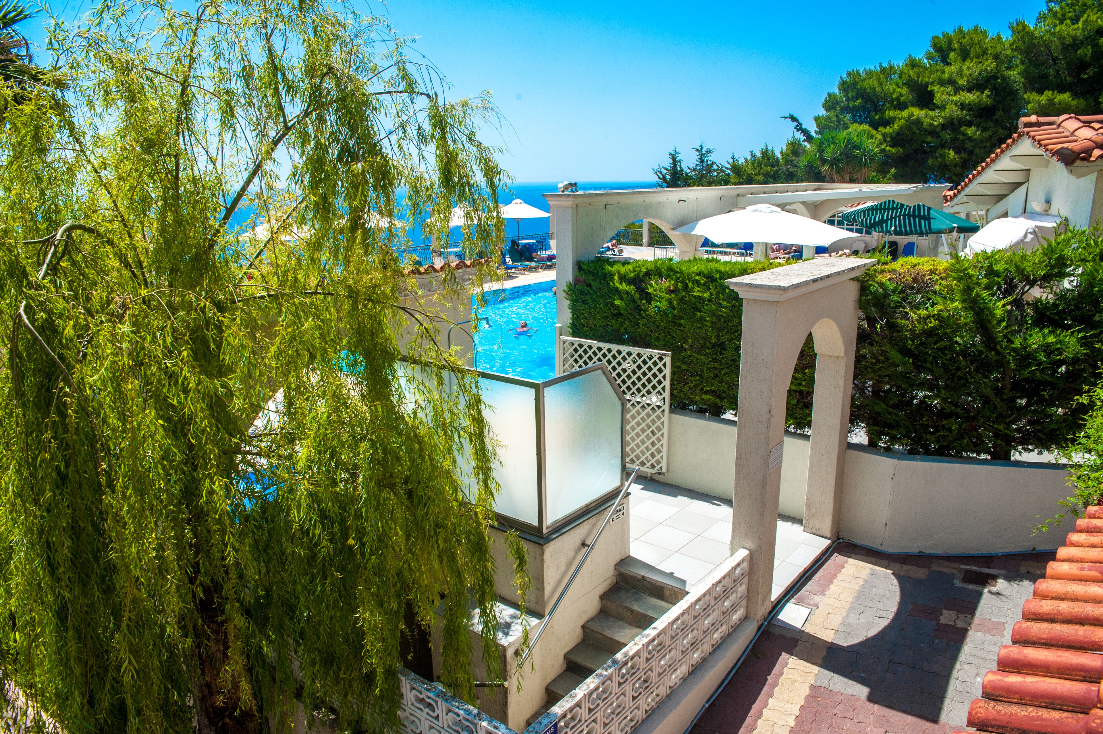 outdoor pool, pool umbrellas, pool loungers