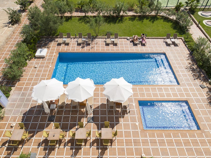 Outdoor pool, open 9:00 AM to 6:00 PM, pool umbrellas, pool loungers
