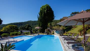 Indoor pool, outdoor pool, pool umbrellas, pool loungers