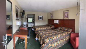 A hotel room with two beds, a desk, a chair, a TV, and a window. - Night Inn (Rowland)