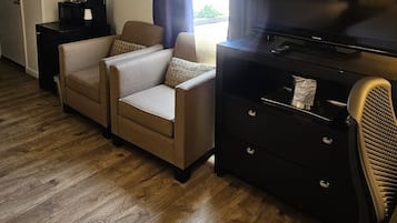 Room, 2 Queen Beds | Living area | 36-inch LED TV with cable channels, TV
