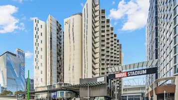 A modern building with a sign for the Marvel Stadium.