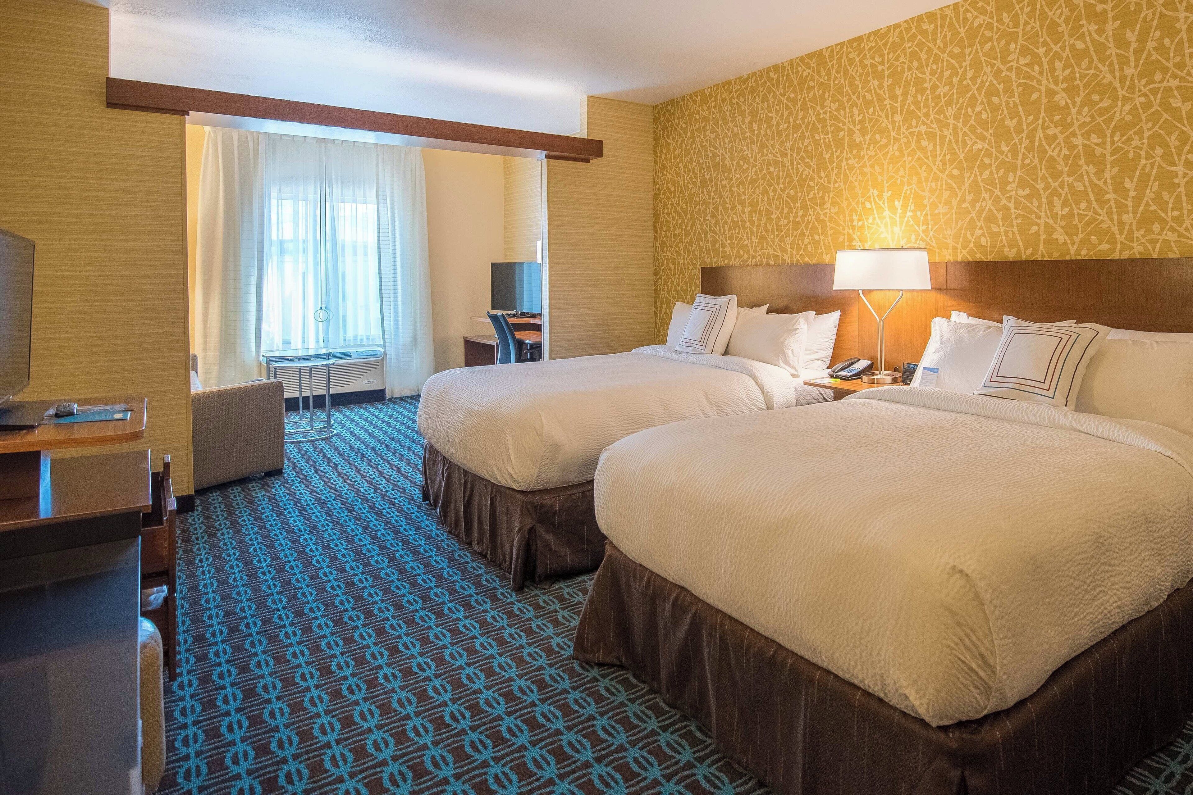 premium bedding, desk, laptop workspace, blackout curtains