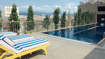 Outdoor pool, open 2:00 PM to 9:00 PM, sun loungers