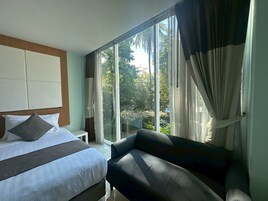 Standard Room | Living area | 32-inch LCD TV with cable channels, TV