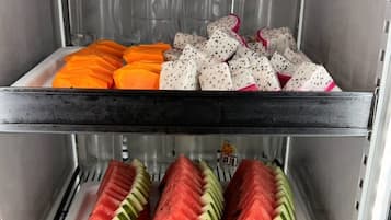 A refrigerated display case with various fruits.