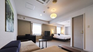 A hotel room with two beds, a TV, a desk, and a sofa. - HOTEL GLOBAL VIEW SAPPORO (Sapporo)