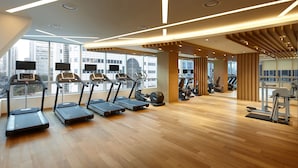 A modern gym with treadmills, stationary bikes, and weight machines. - LOTTE CITY HOTEL MYEONGDONG (Seoul)