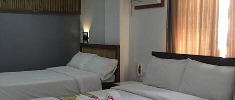 Twin Room | Minibar, in-room safe, desk, blackout drapes