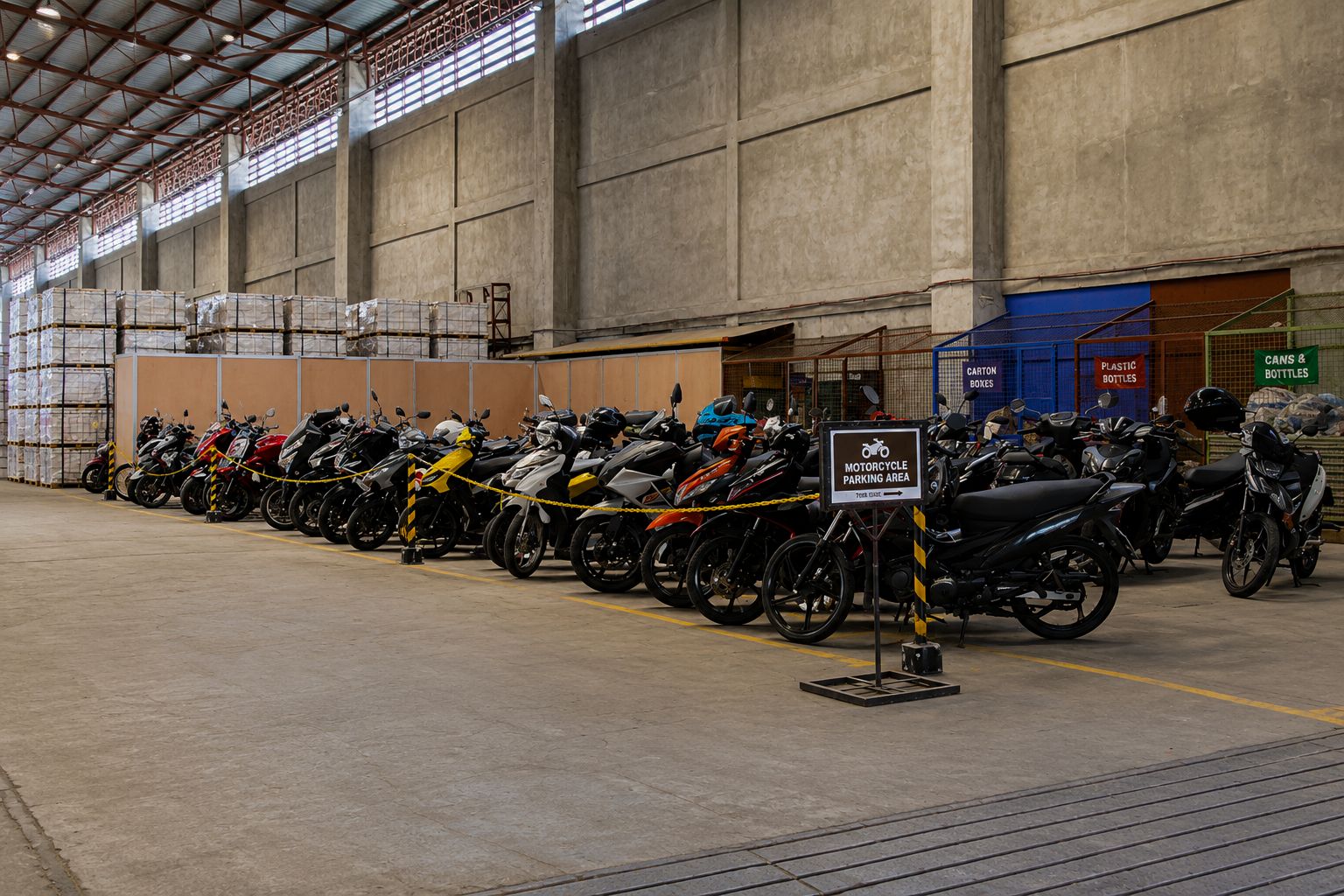 A large indoor space with rows of motorcycles parked in an orderly fashion, a sign indicating a motorcycle parking area, and various storage units with labeled sections for different items.
