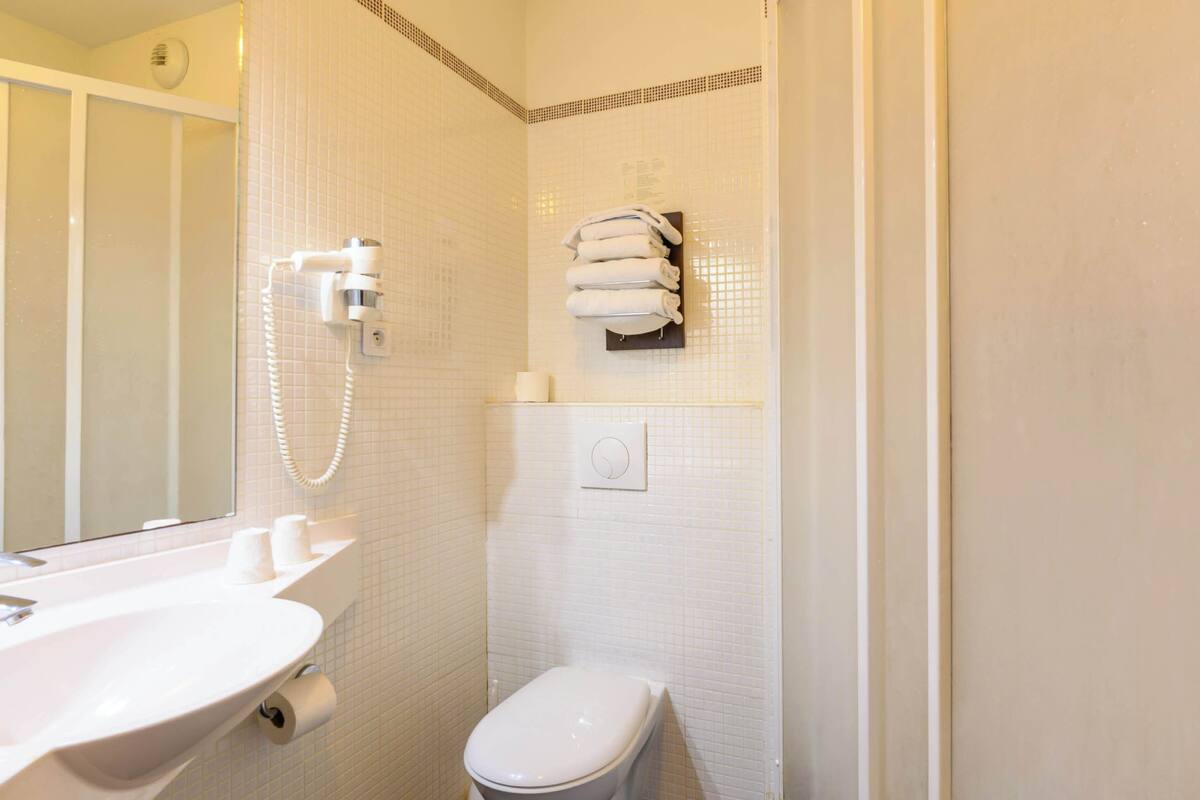 shower, eco-friendly toiletries, hair dryer, towels