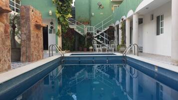 Outdoor pool, open 8:00 AM to 8:00 PM, sun loungers