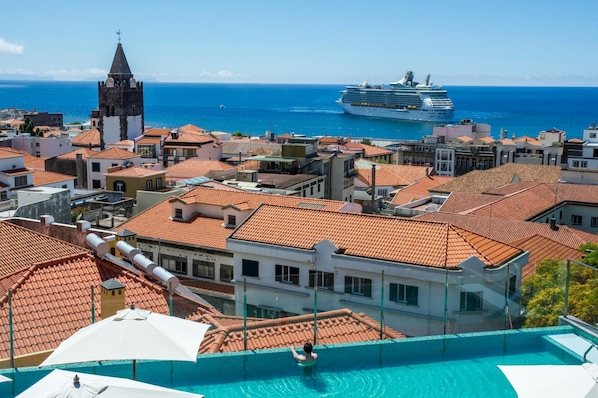 Indoor pool, outdoor pool, open 10:00 AM to 7:00 PM, pool umbrellas