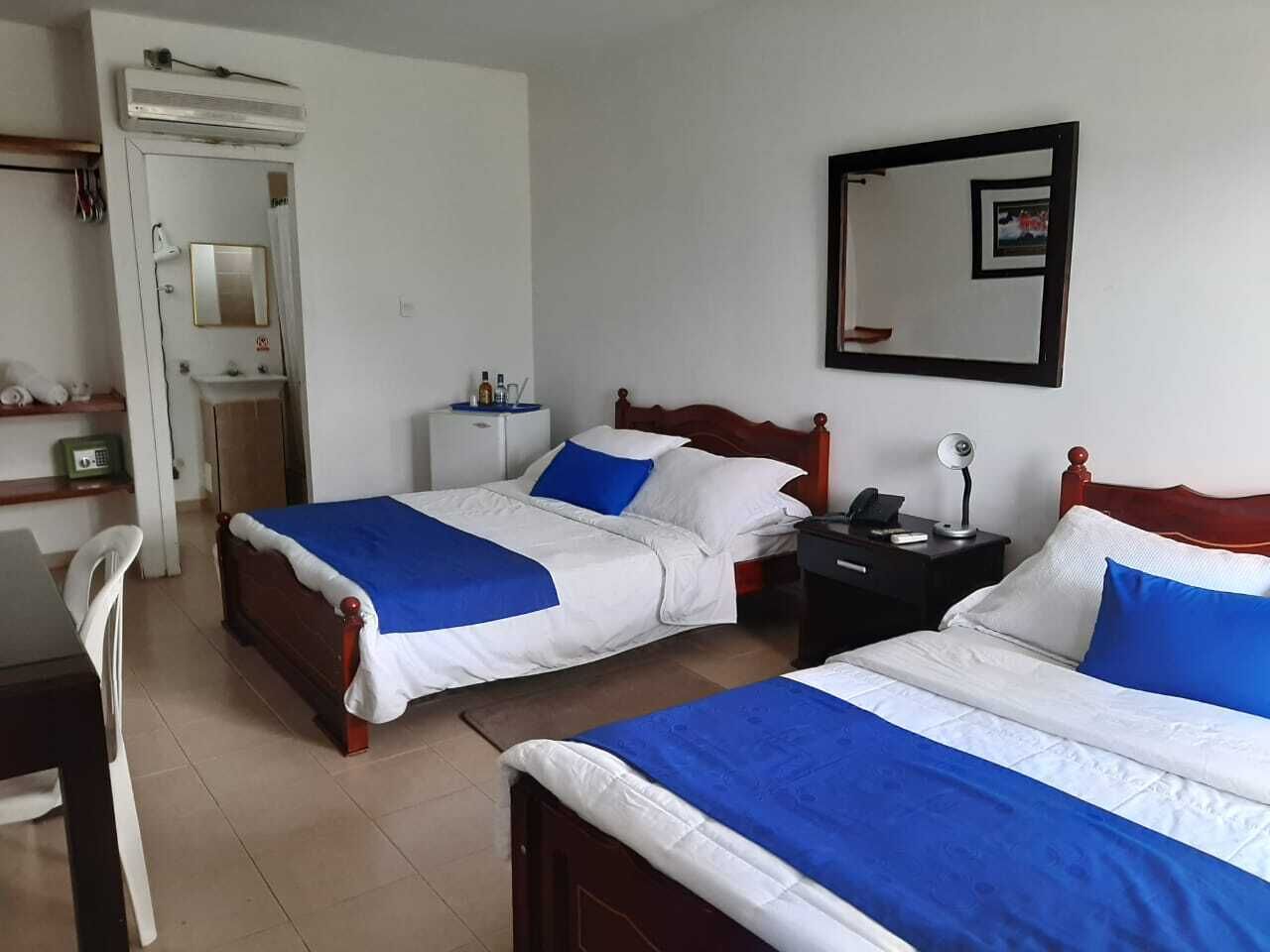 Deluxe Room, 2 Double Beds, Air conditioning, Garden View | In-room safe, individually furnished, desk, blackout drapes