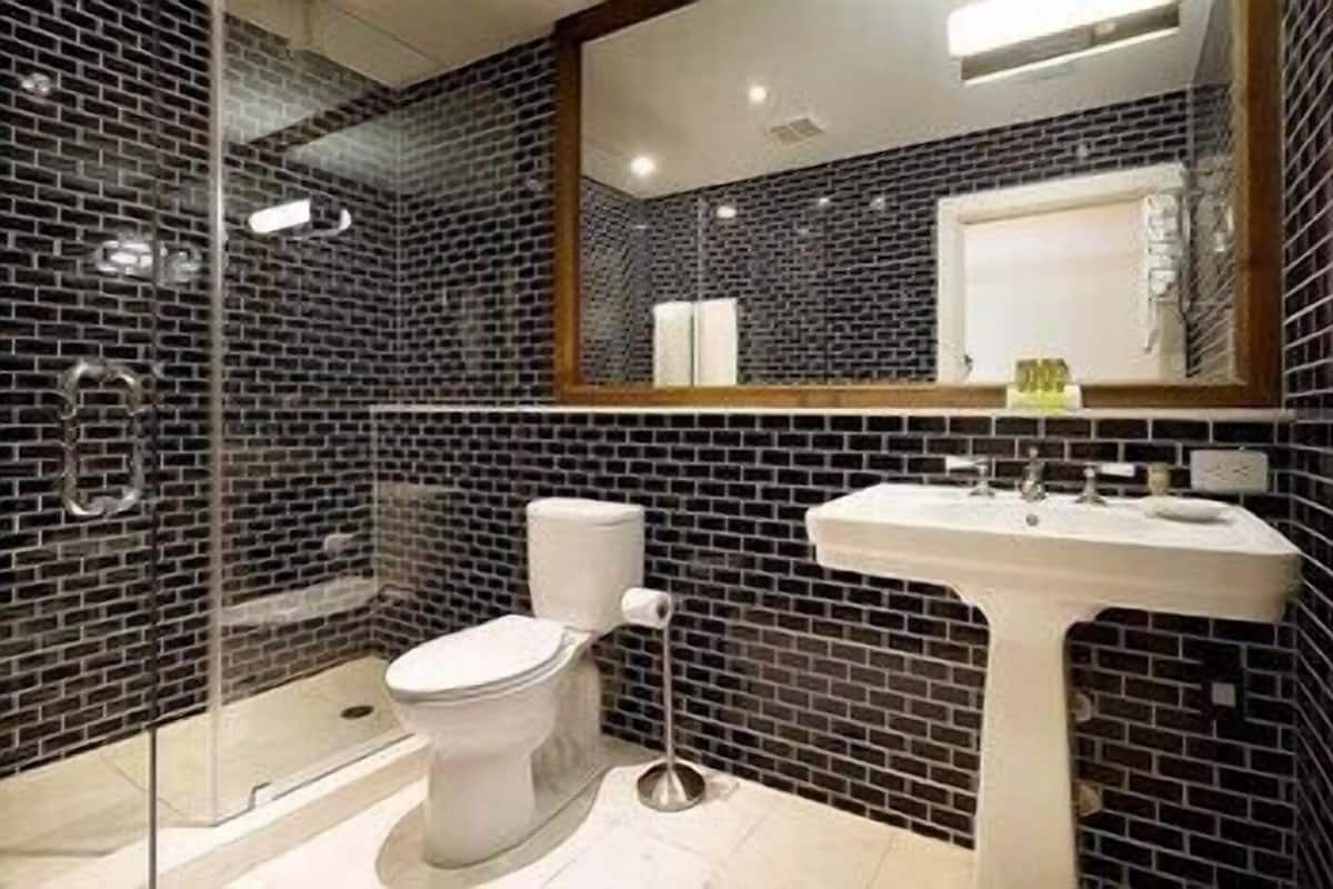 Bathroom | Shower, rainfall showerhead, eco-friendly toiletries, hair dryer