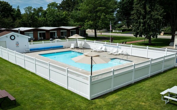 Seasonal outdoor pool, open 9 AM to 10 PM, pool umbrellas, pool loungers