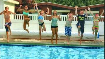 Seasonal outdoor pool, open 9 AM to 10 PM, pool umbrellas, pool loungers