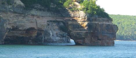 A natural rock formation with a narrow passageway.
