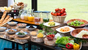 A buffet table with various food items and condiments. - Azumino Hotaka View Hotel (Azumino)