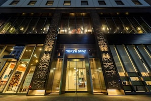 A modern building with a prominent entrance labeled 'TOKYU STAY'. - Tokyu Stay Ginza (Tokyo)