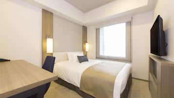A hotel room with a bed, bedside lamps, a TV, a desk, and a window with curtains.