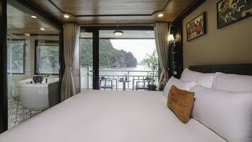 Suite junior, balcón | 1 dormitorio y ropa de cama de alta calidad