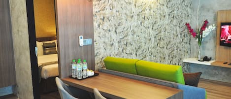 Executive Apartment, 2 Bedrooms, Kitchenette | Living area | 32-inch LED TV with premium channels, TV