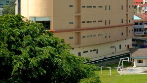 A multi-story hotel with a curved facade, numerous windows, and a flat roof. - Oriental Crystal Hotel Kajang (Kajang)