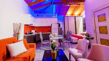 A modern interior with a kitchen, dining area, and living space.