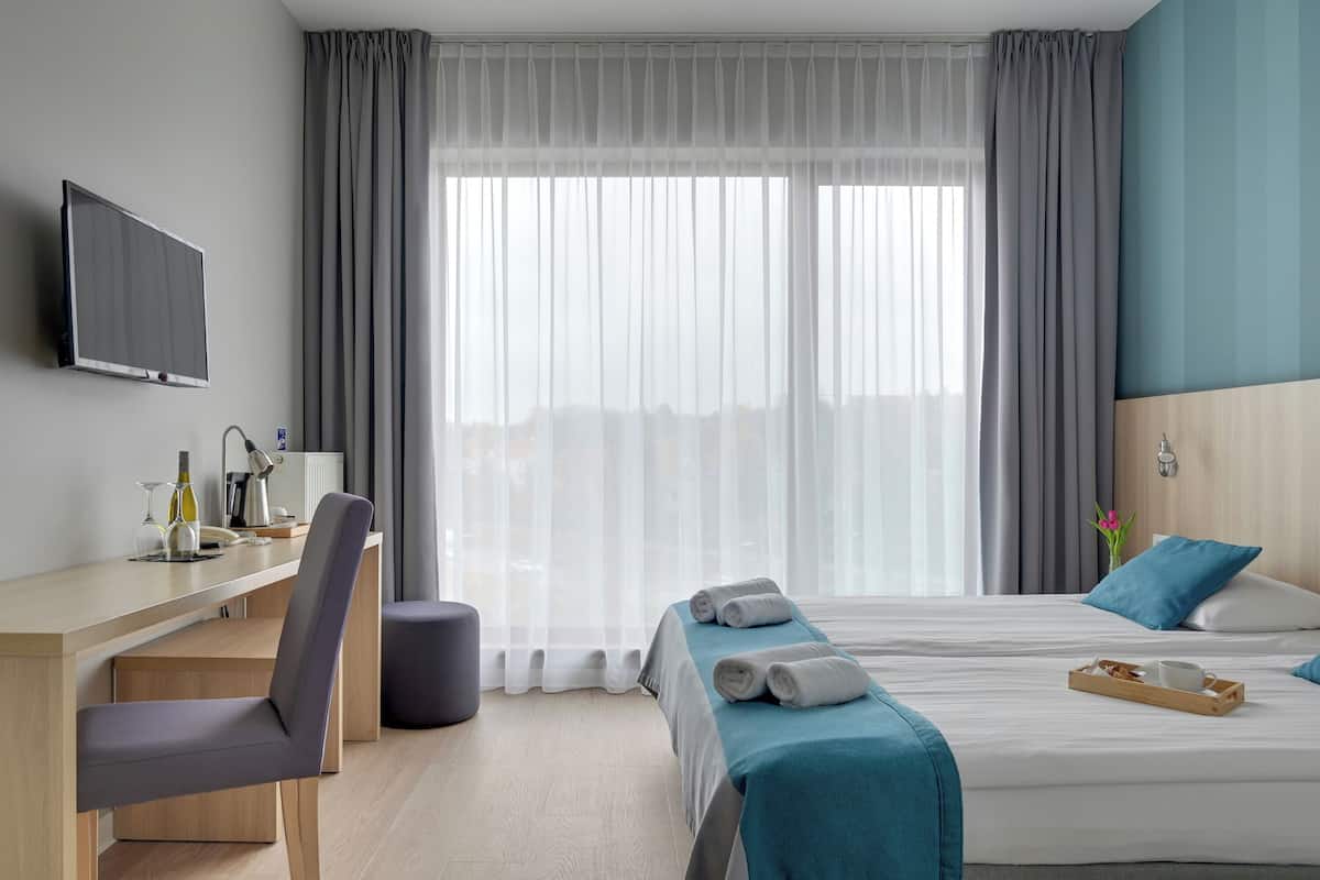 Desk, blackout curtains, iron/ironing board, free cots/infant beds