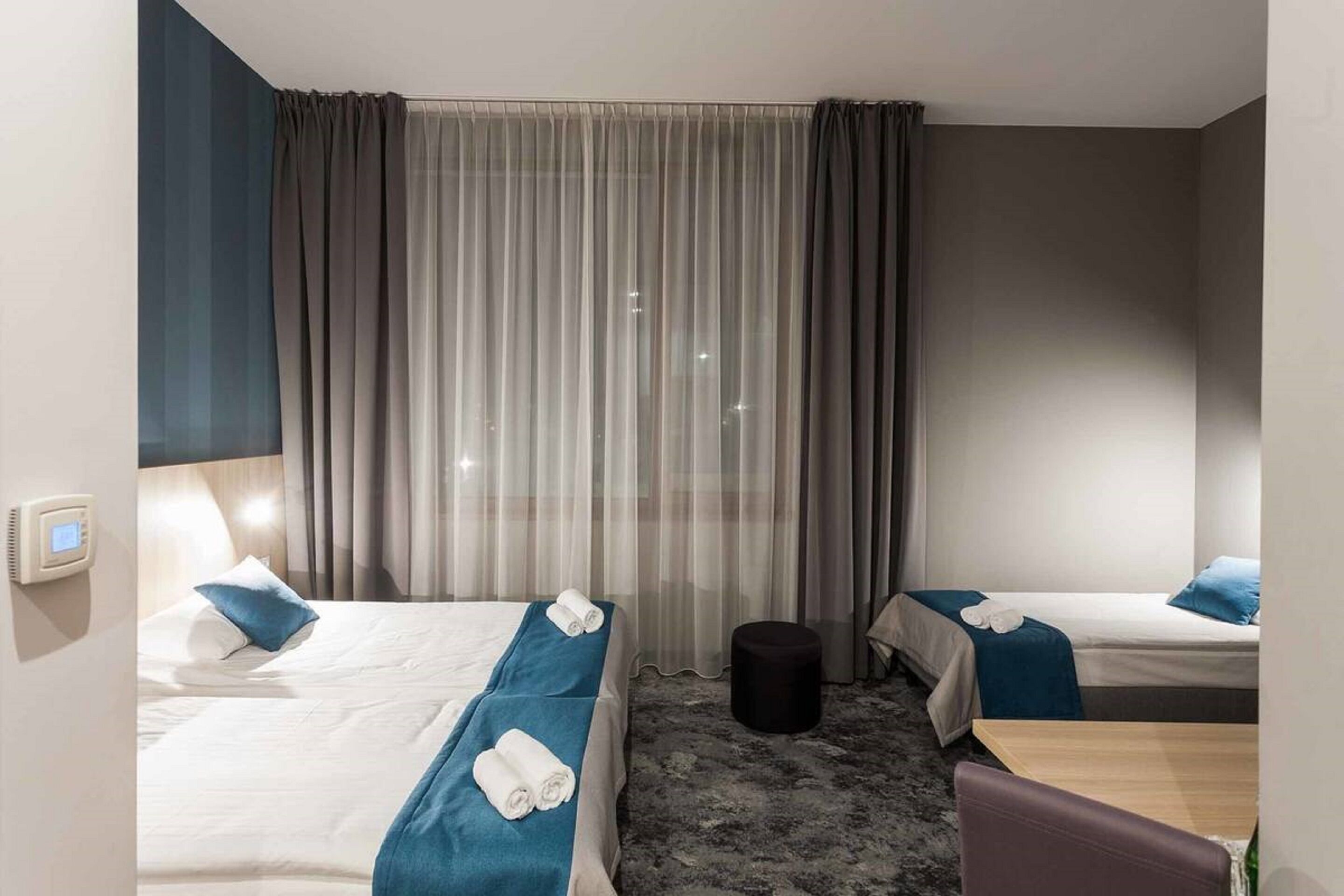 deluxe triple room | desk, blackout curtains, iron/ironing board, free cots/infant beds