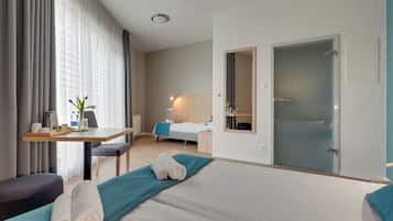 Desk, blackout curtains, iron/ironing board, free cots/infant beds