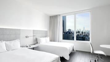 A hotel room with two beds, a desk, a chair, and a large window offering a city view.