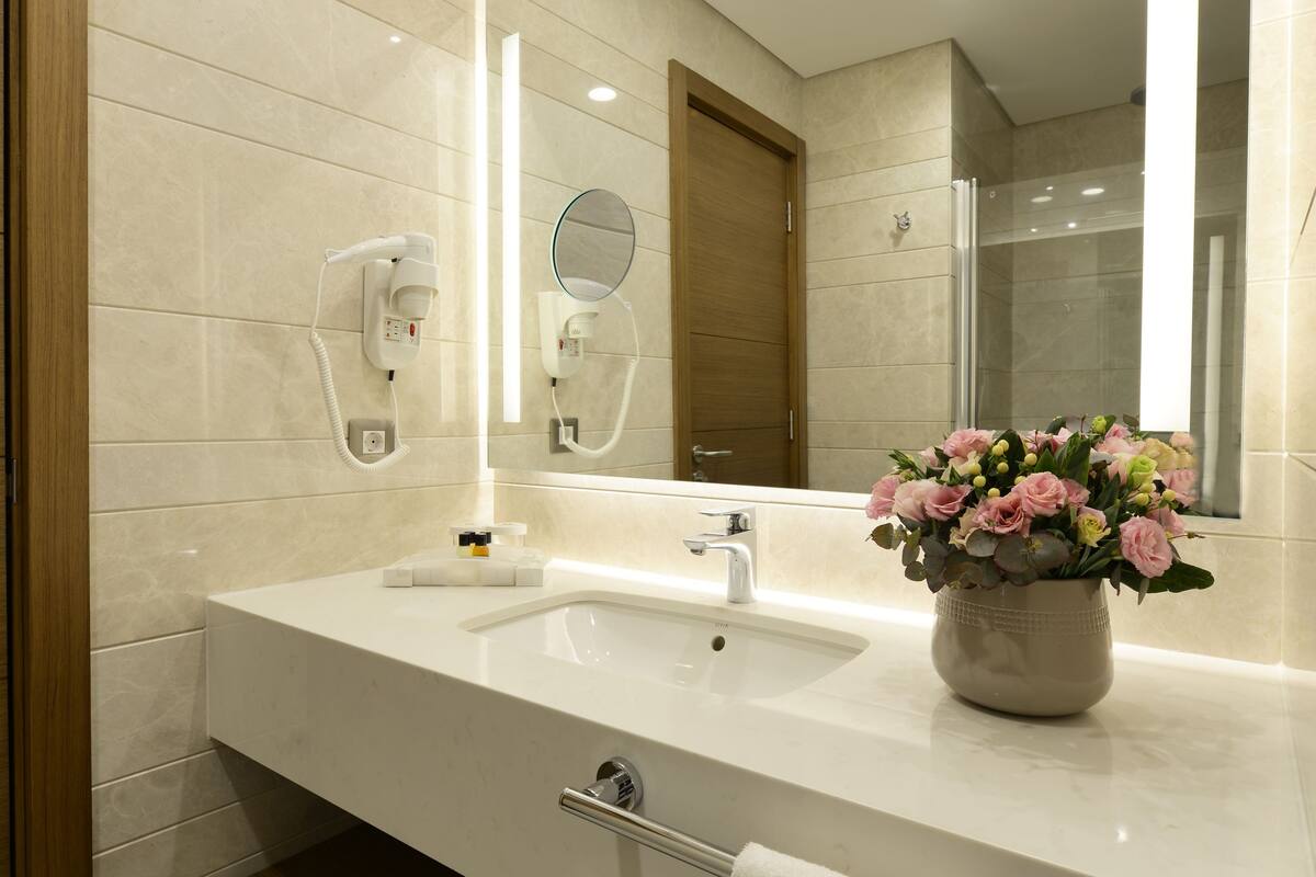 standard room, 1 queen bed with sofa bed, city view | bathroom | free toiletries, hair dryer, slippers, towels