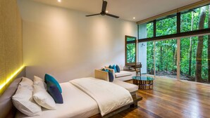 A modern bedroom with a large window, a ceiling fan, and a wooden floor. - Palmstone Retreat - Kithulgala (Kithulgala)