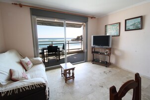 Apartment, 2 Bedrooms, Terrace, Sea View | Living room | Flat-screen TV