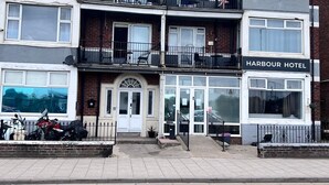 A multi-story hotel with a prominent 'Harbour Hotel' sign.