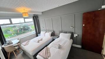 Family Triple Room, Ensuite, Sea View | 1 bedroom, free WiFi, bed sheets