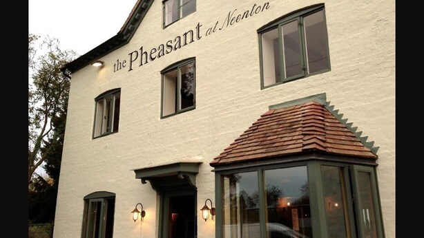 A building with the sign "the Pheasant at Neenton" indicating a hotel. It features a traditional architectural style with a pitched roof and multiple windows. - The Pheasant at Neenton (Bridgnorth)