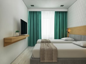 Deluxe tweepersoonskamer | Een bureau, gratis babybedden, gratis wifi