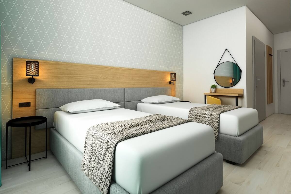 Deluxe tweepersoonskamer | Een bureau, gratis babybedden, gratis wifi
